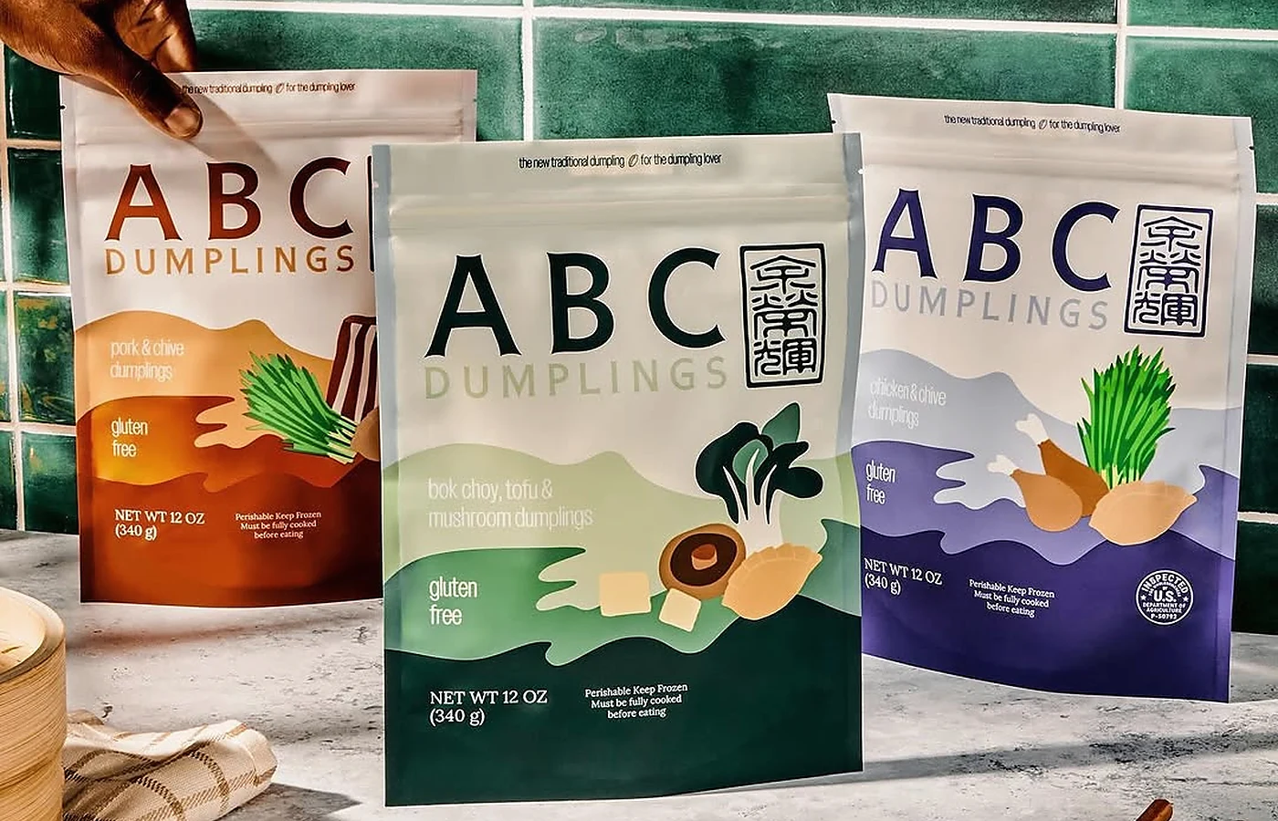 Mixed-preference gluten-free dumpling night with separate vegetarian, chicken and pork dumpling platters, sauces and vegetables