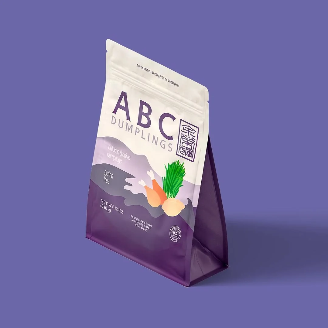 Organic chicken and chive ABC Dumplings pack on a purple background
