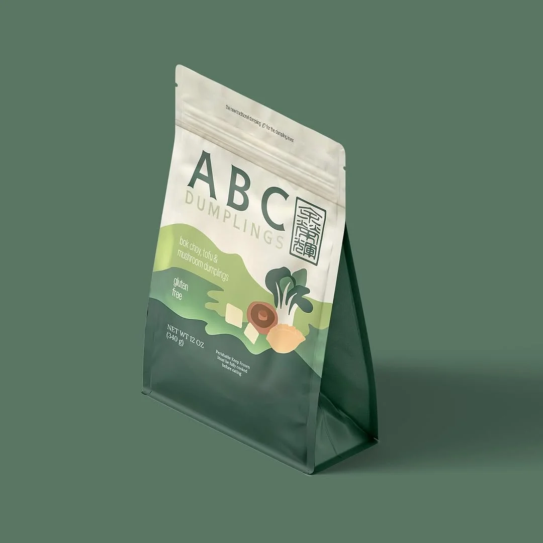 Bok choy, tofu and mushroom ABC Dumplings pack on a green background